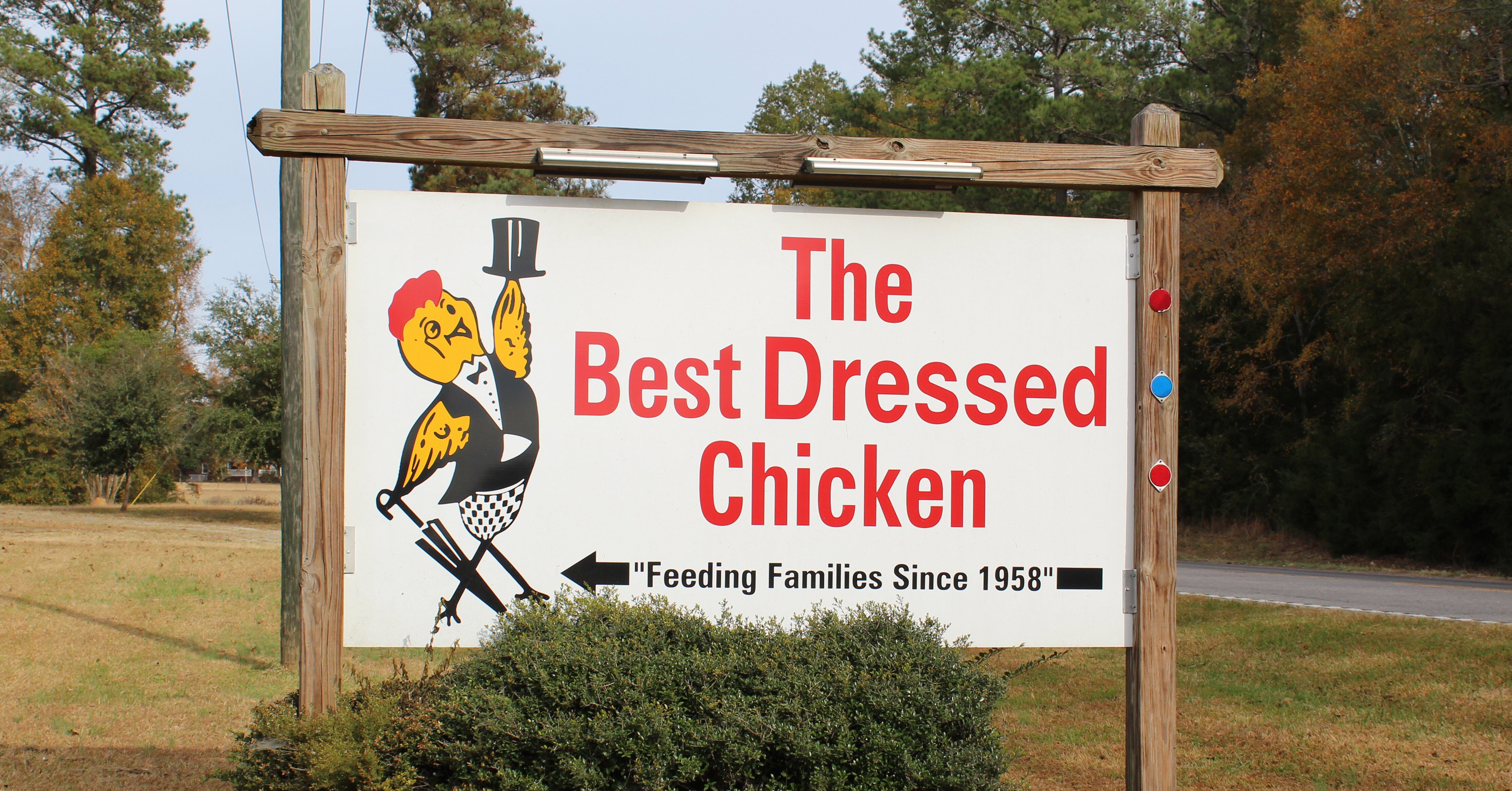 front sign for the best dressed chicken, a poultry farm